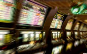 Filipino players enjoying 747-1 live mobile sports betting and slots on their phones
